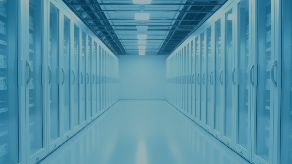 A long and brightly lit hallway in a modern data cooling center